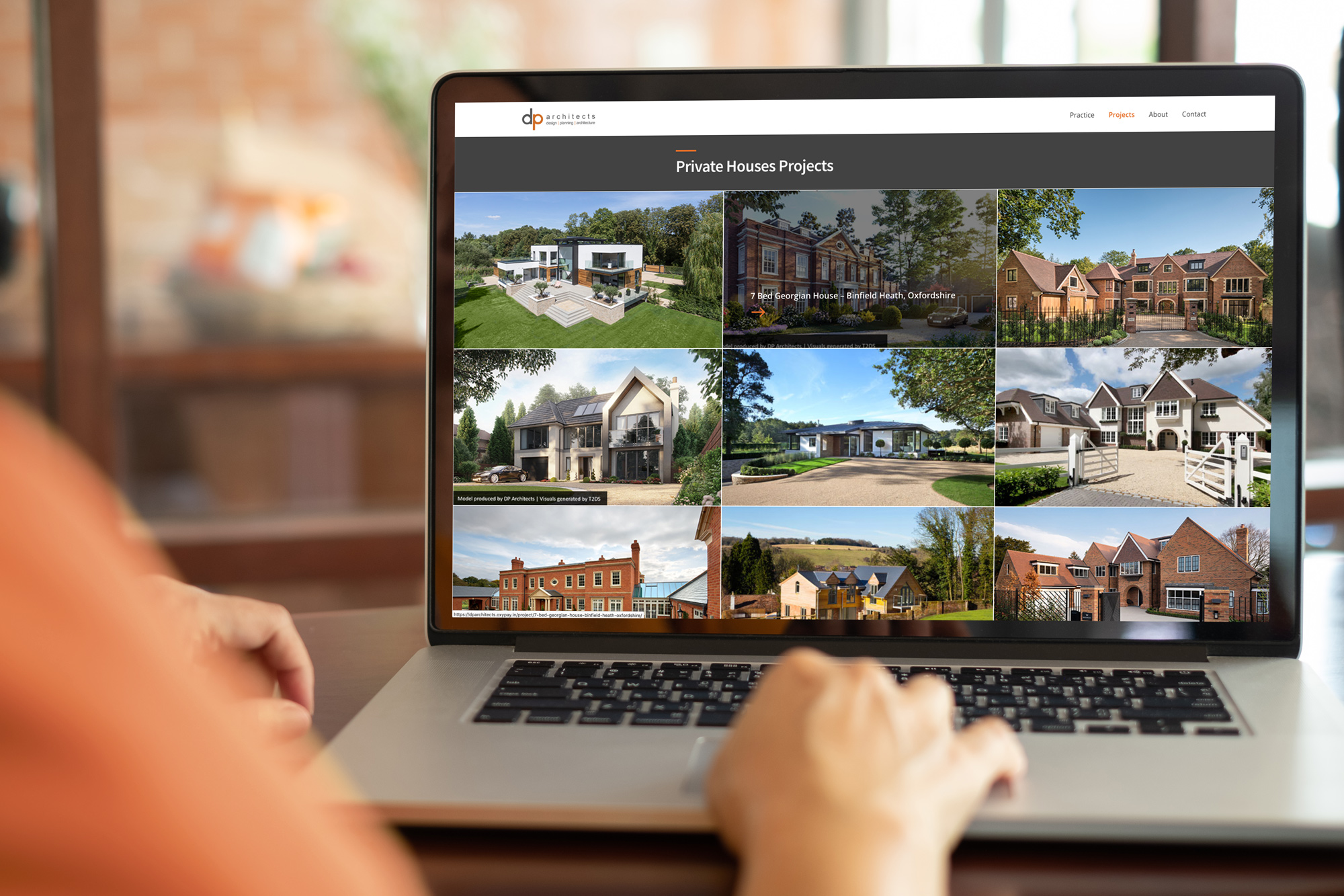 dp architects website screen on laptop viewing architect projects